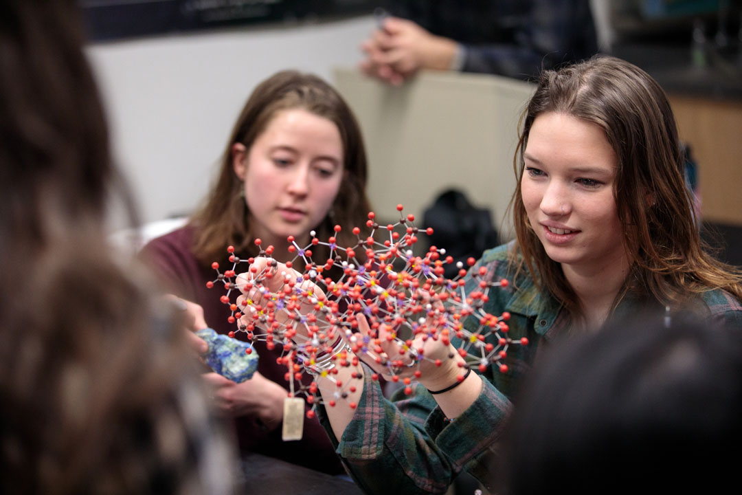 geology students examine a molecule