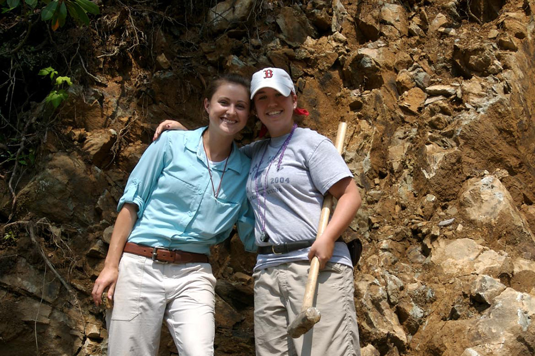 two geology students posing on the field